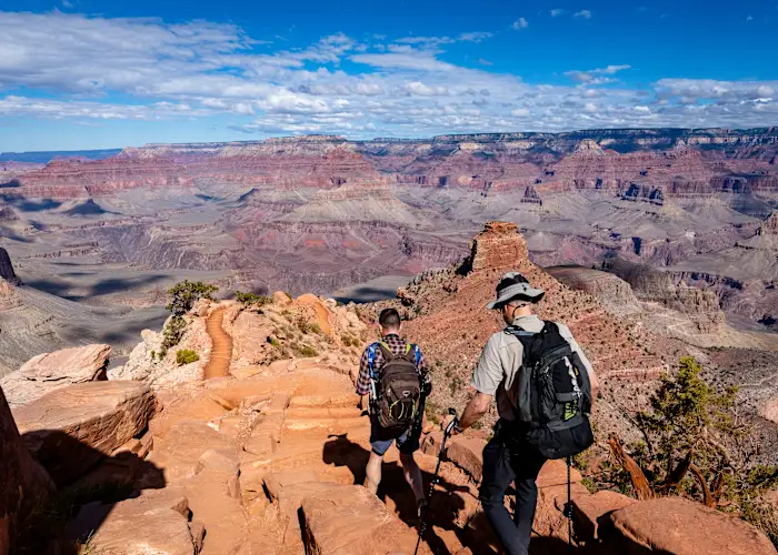 People hiking down the South Kaibab Trail at the Grand Canyon